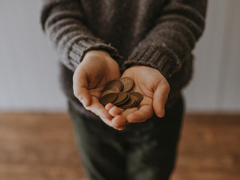 Kids holding coins